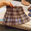 Girls' plaid pleated A-line skirt in a cotton blend fabric, shown on a hanger.