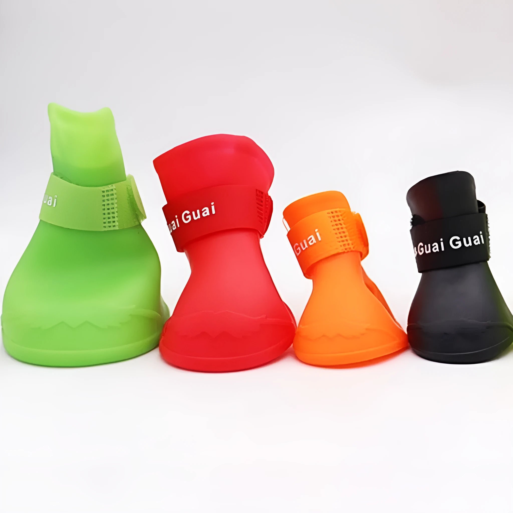 Set of four colourful rubber pet rain shoes with soft soles for dogs or cats.