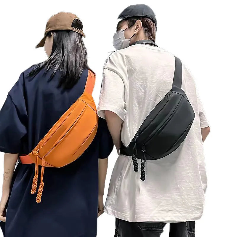 Men's black crossbody chest bag with adjustable shoulder strap showing front compartment
