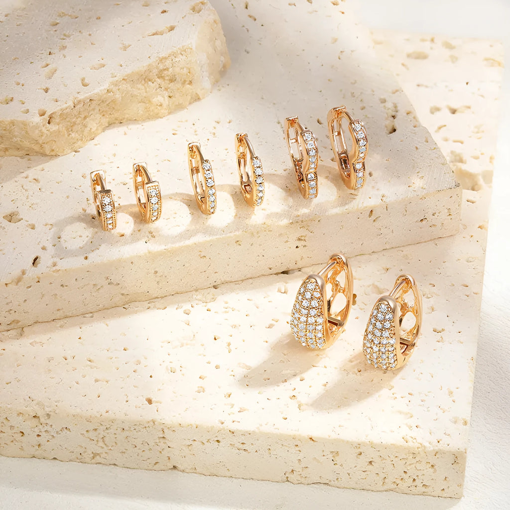 Brass gold plated heart shape zircon ear clip earrings showing ear clip mechanism and stone accents