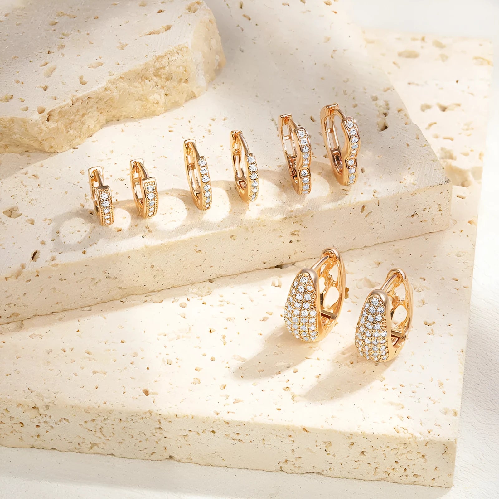 Brass gold plated heart shape zircon ear clip earrings showing ear clip mechanism and stone accents