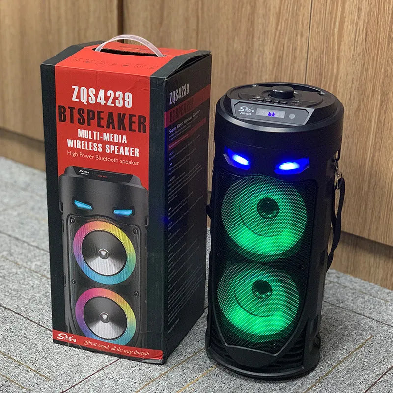 Black portable Bluetooth speaker with colourful dual horns, showing front panel with controls.