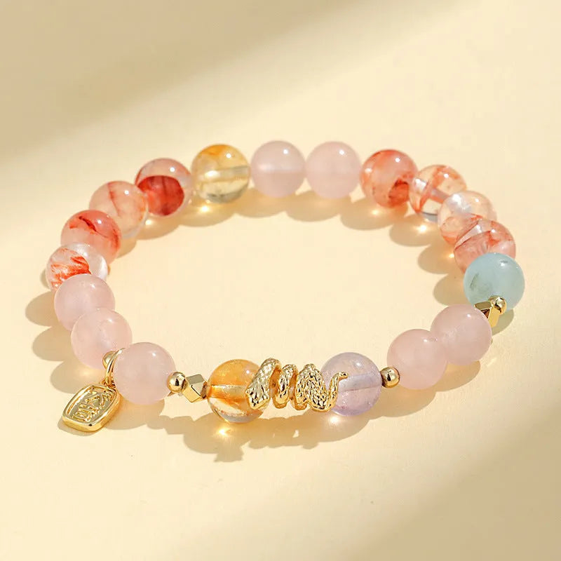 Women's lucky snake crystal bracelet with plastic flower charms and traditional Fu snake design in manual processing