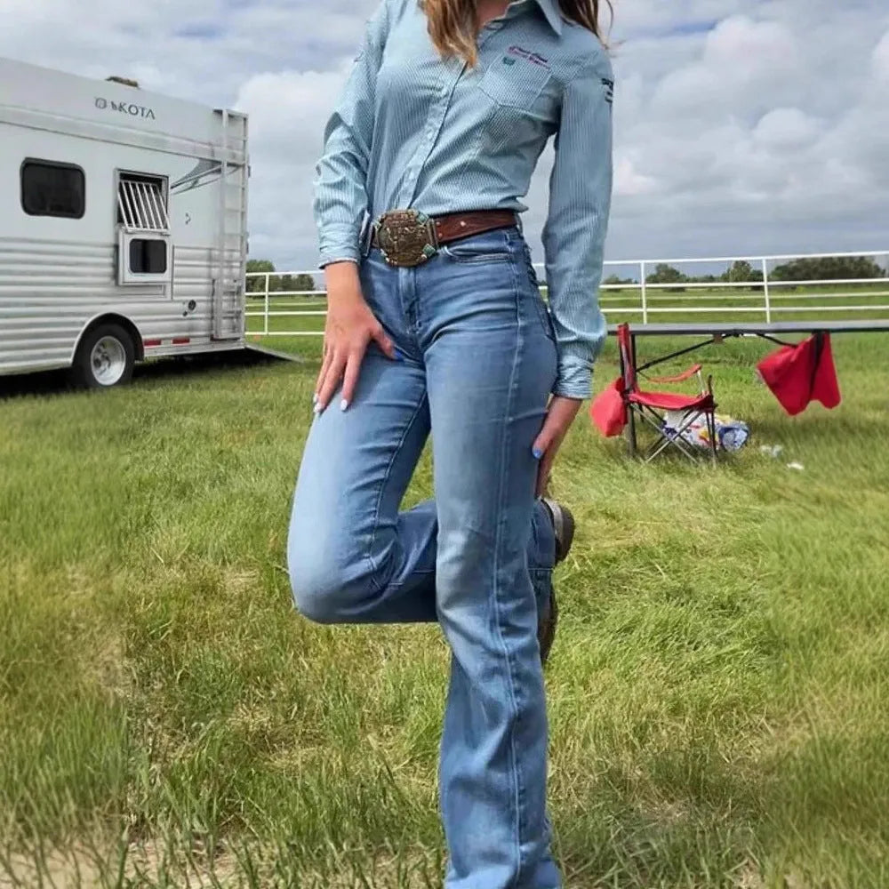 Slim fit blue denim jeans with red embroidery detailing on the legs, showing a slight flare from the knee.