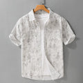 Men's light pink hanging dyed printed short sleeve cotton cardigan with loose fit on hanger