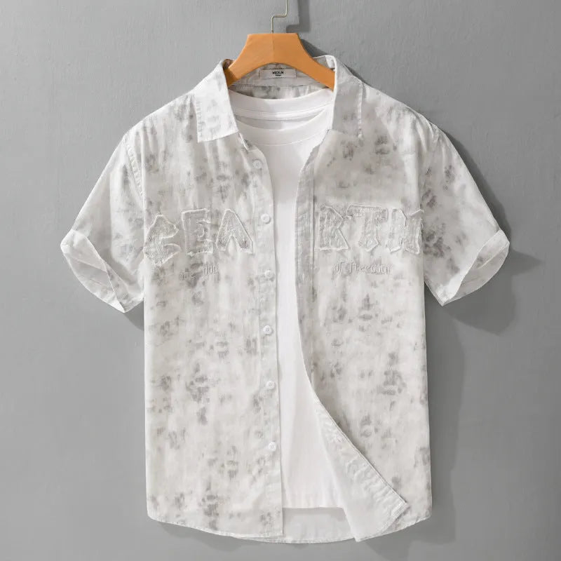Men's light pink hanging dyed printed short sleeve cotton cardigan with loose fit on hanger