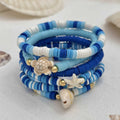 Set of six handmade geometric shell bracelets in Bohemian blue polymer clay.