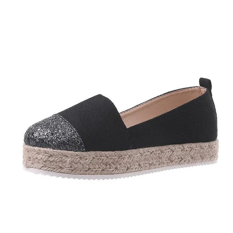 Plus size beige and black breathable canvas flat shoes with round toe and slip-on design.