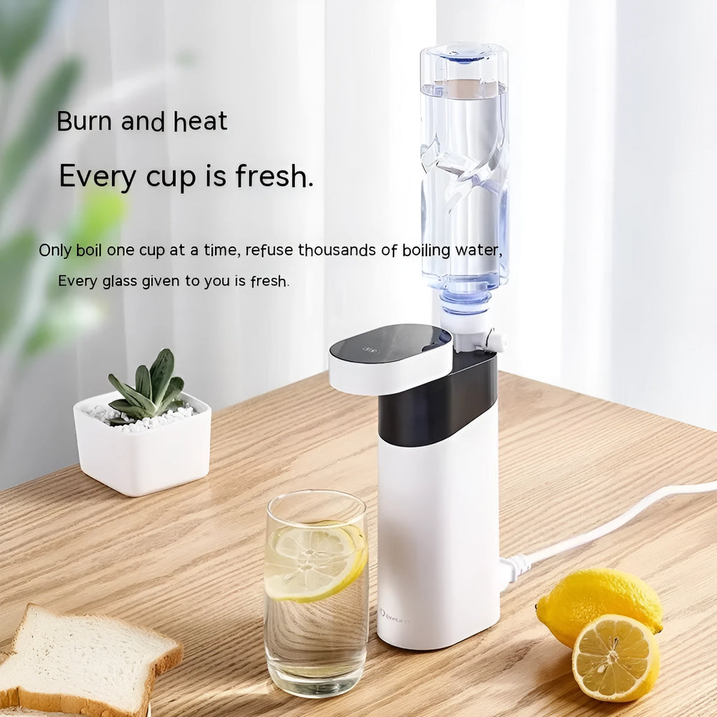 Black and green compact desktop instant water dispenser with digital display on a wooden desk.