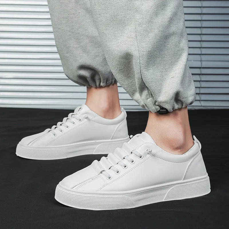 Men's black and white low top sports shoes with synthetic leather upper, mesh panels, and a flat PVC sole.