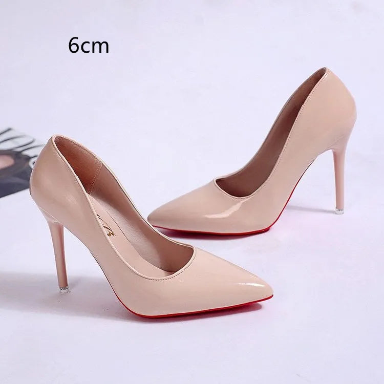 Women's black stiletto pumps with pointed toe and shallow mouth design on white background