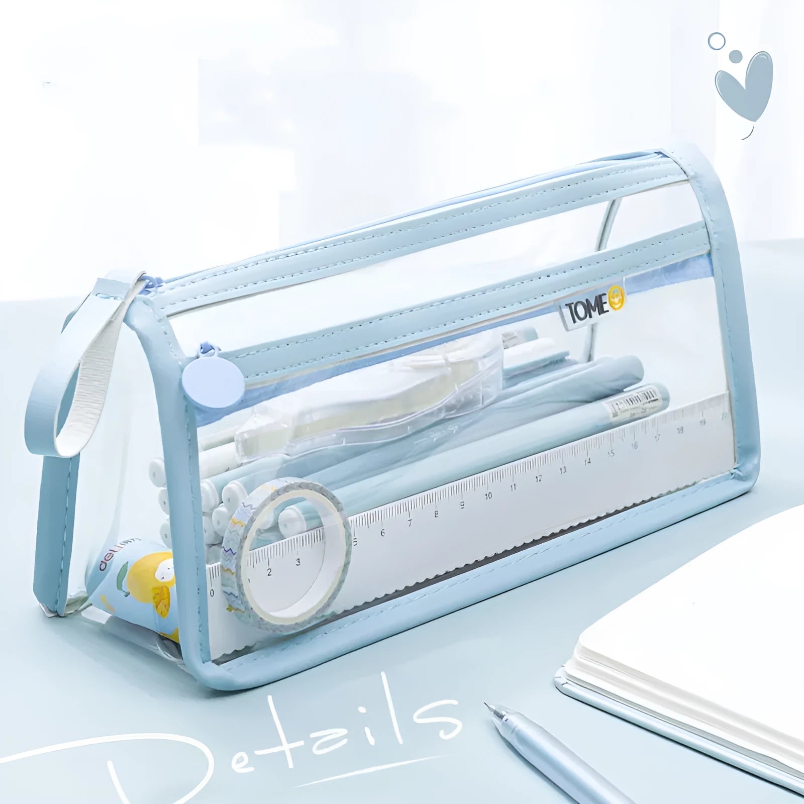 Large transparent double-layer pencil case in blue showing two compartments for exam stationery.